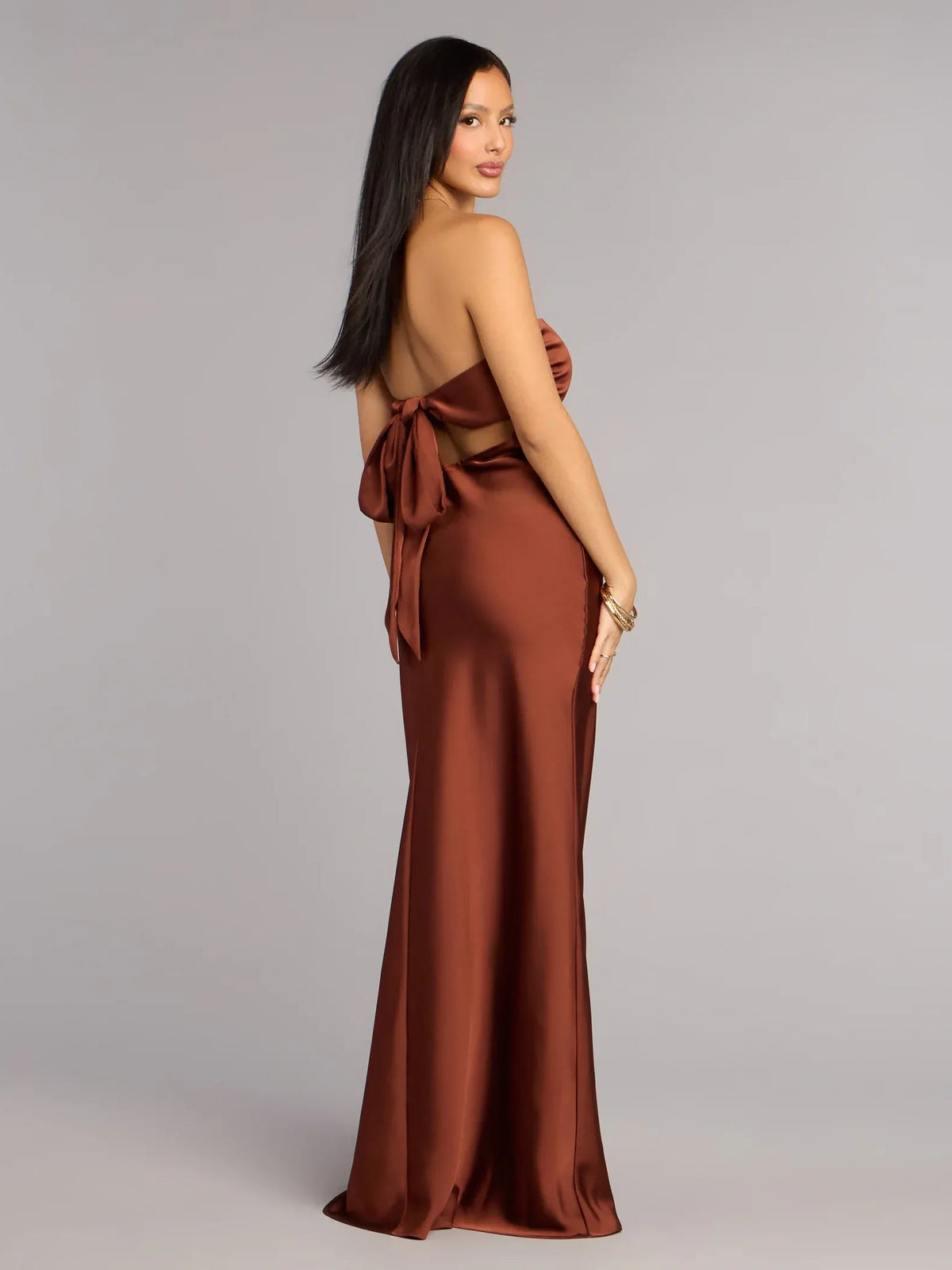 Brown strapless sheath formal dress with open back tied bow, floor-length
