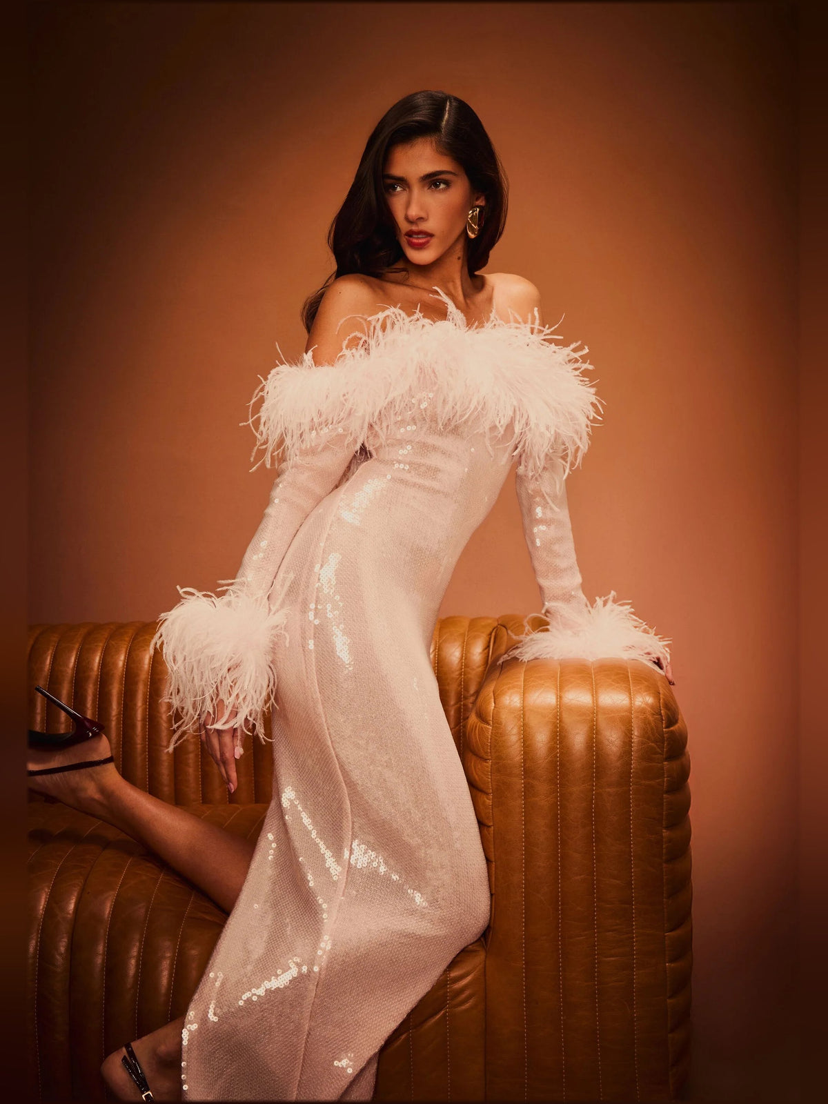 Pink sequin midi dress with feathered shoulders, side-slit detail, fitted waist