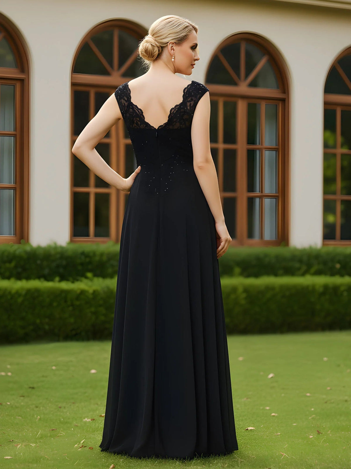 Black sleeveless formal gown with V-back lace bodice and beaded accents, A-line floor-length.