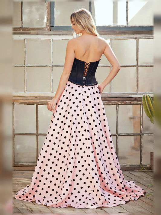 Sweetheart corset formal dress, back view with black corset and blush polka-dot skirt