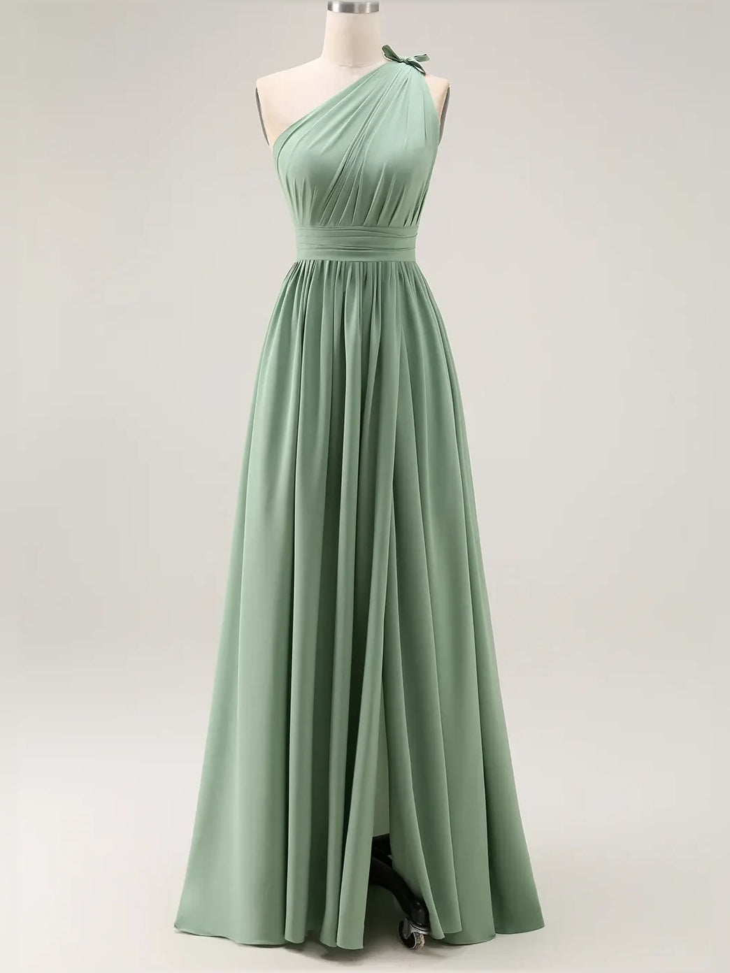 Dusty sage one-shoulder chiffon bridesmaid dress on mannequin with ruched waist