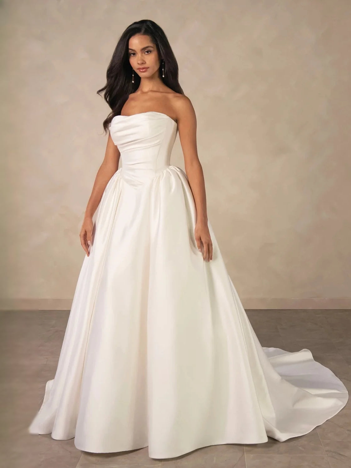 Ivory strapless A-line satin wedding dress with gathered waist and floor-length skirt