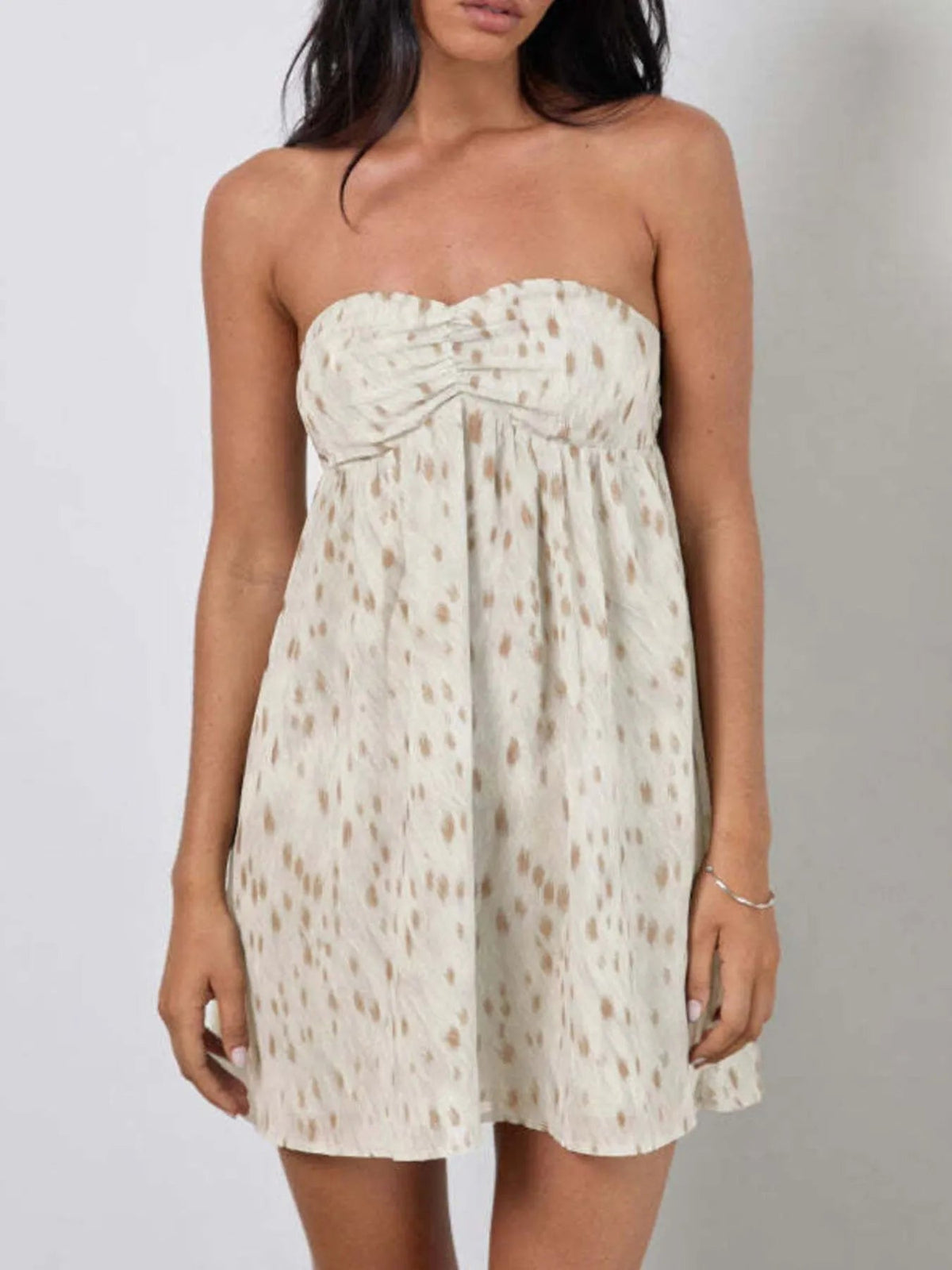 Sweetheart mini dress with strapless sweetheart neckline, ruched front, speckled off-white