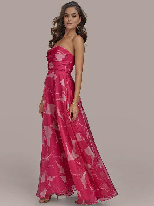 Fuchsia strapless ruched formal dress with abstract white print, side view, floor length
