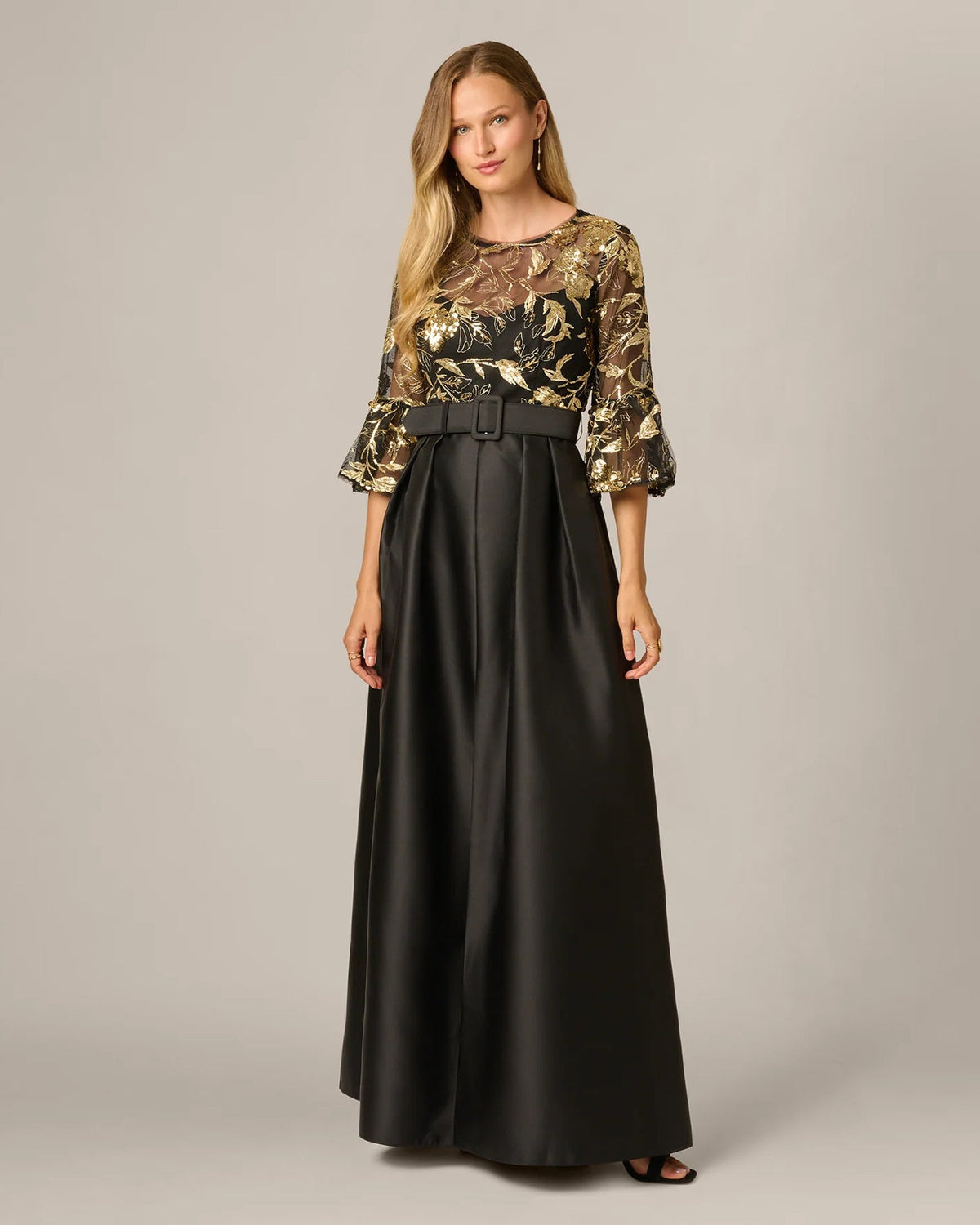 Black A-line maxi dress with gold floral embroidery sleeves and dark waist belt