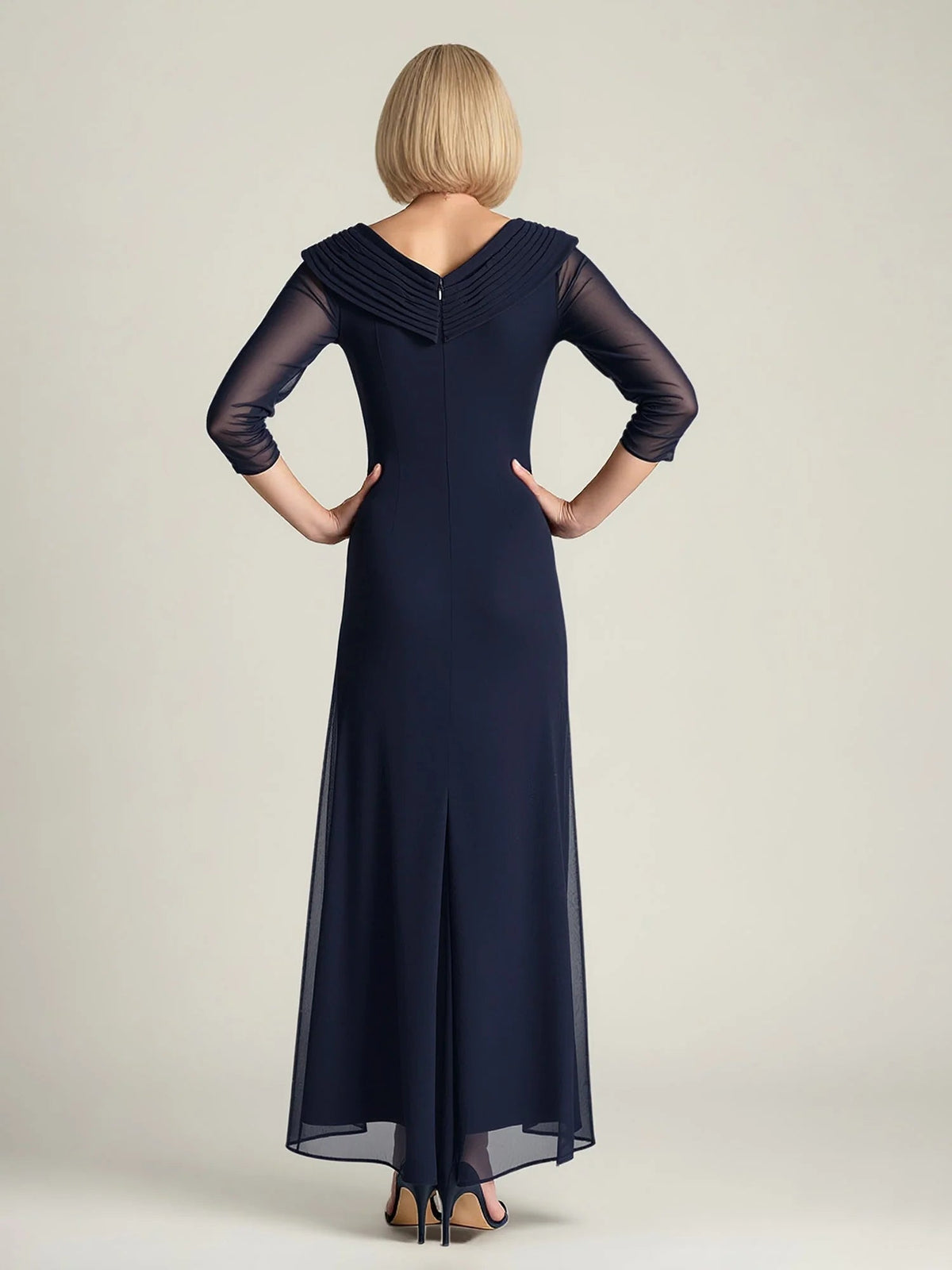 Dark navy back view of V-neck A-line chiffon dress with ruched seams and sheer sleeves