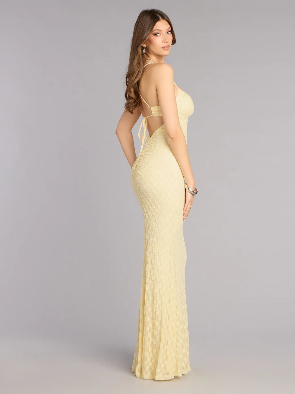 Yellow ruched sweetheart formal dress with spaghetti straps, side view, floor-length
