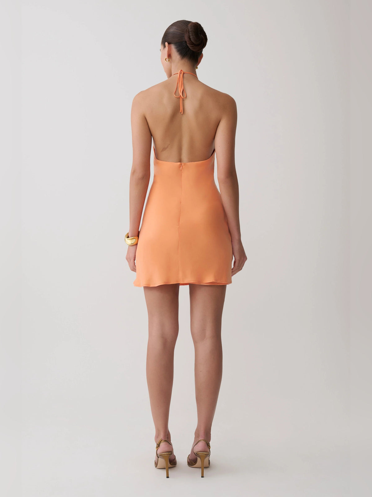 Orange halter mini dress, open back with tie detail and keyhole cutout