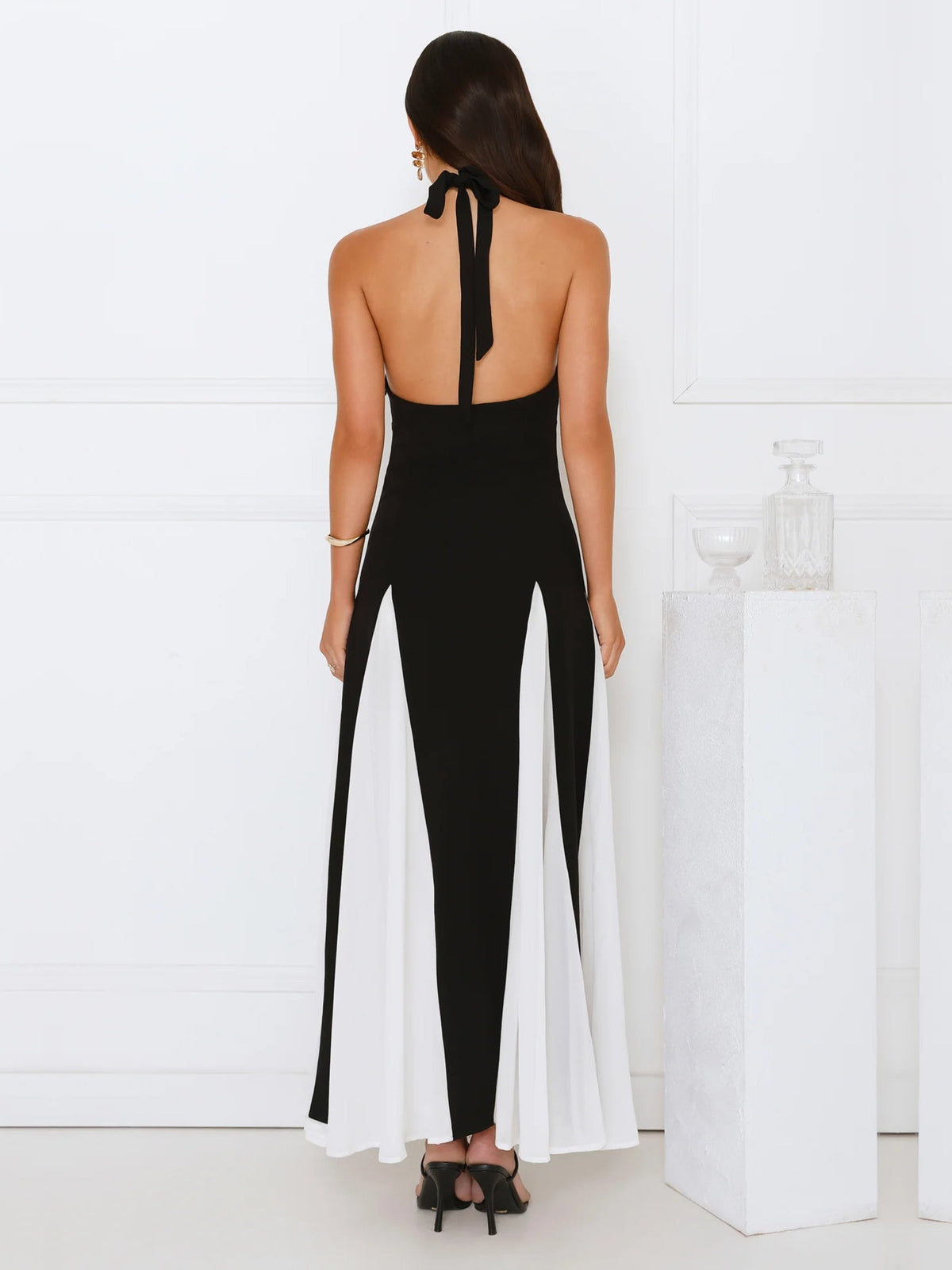 Black sheath maxi formal dress with cutout detail, full-length back view