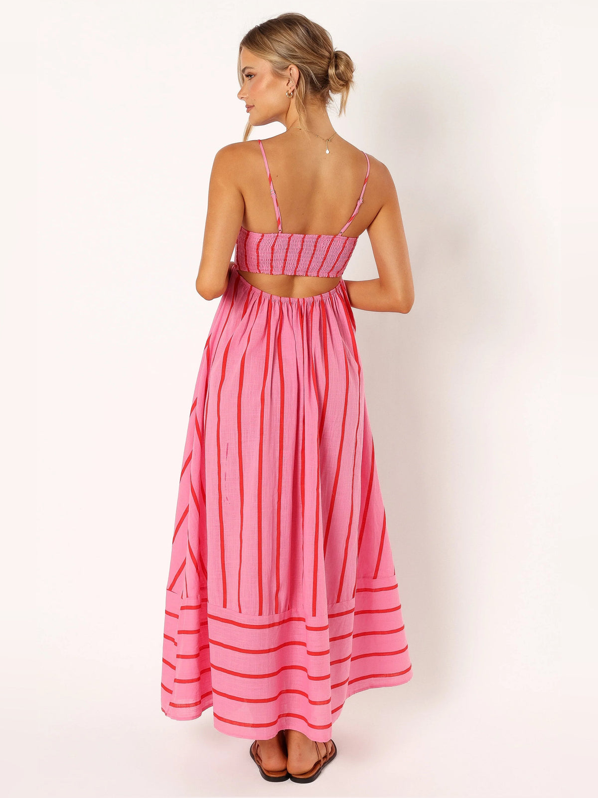 Red a-line maxi formal dress with printed pattern, full-length back view