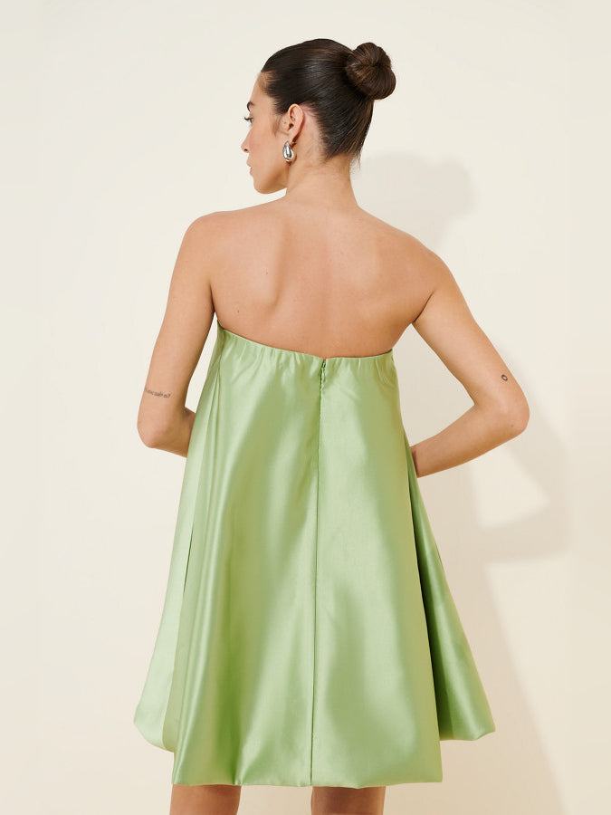 Back view of lime green strapless mini dress with sweetheart neckline and bow detail