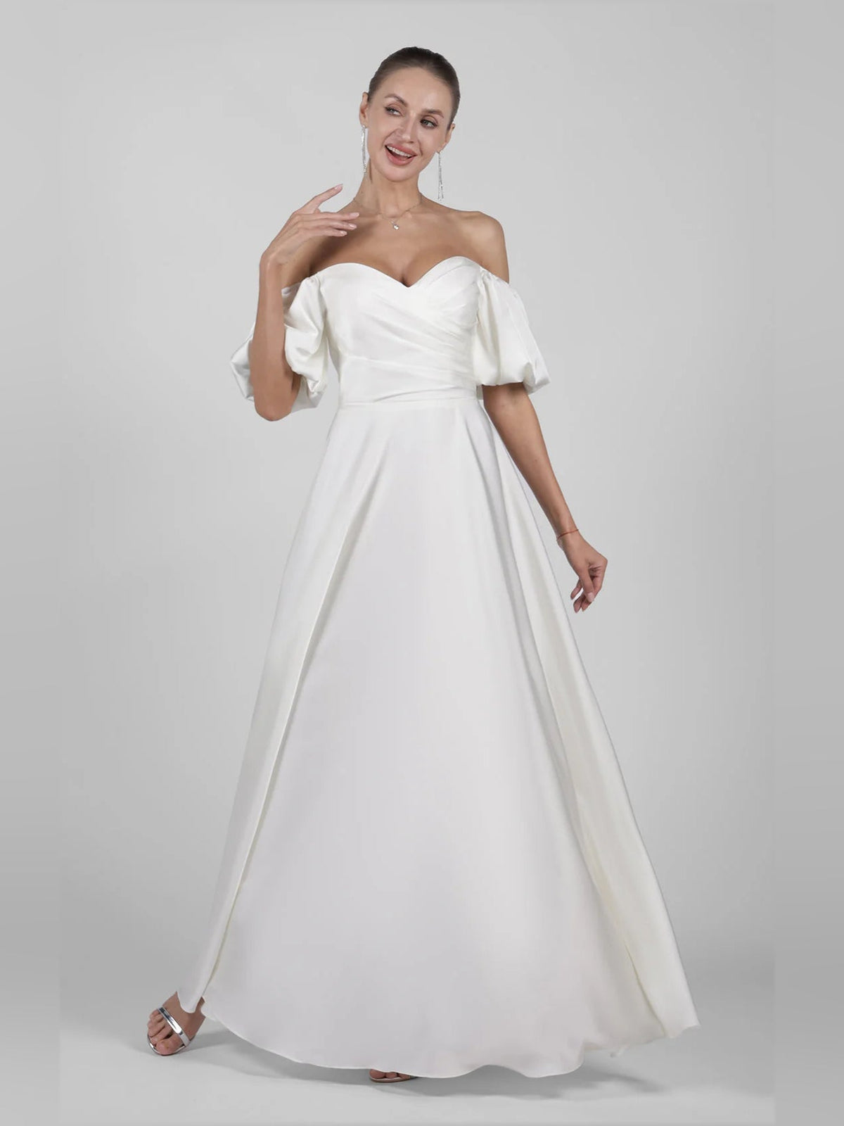 Ivory off-shoulder satin A-line maxi wedding dress with wide sweetheart neckline