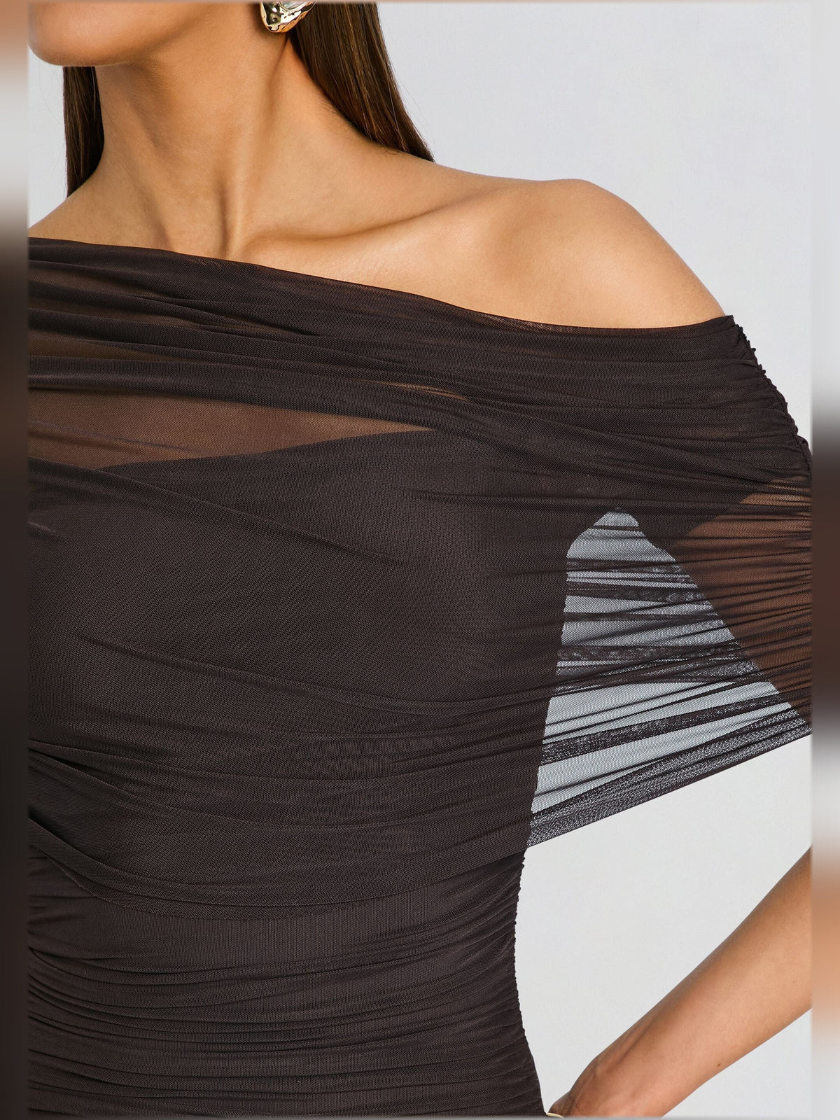 Black mesh off-shoulder dress bodice with draped neckline and ruched texture detail