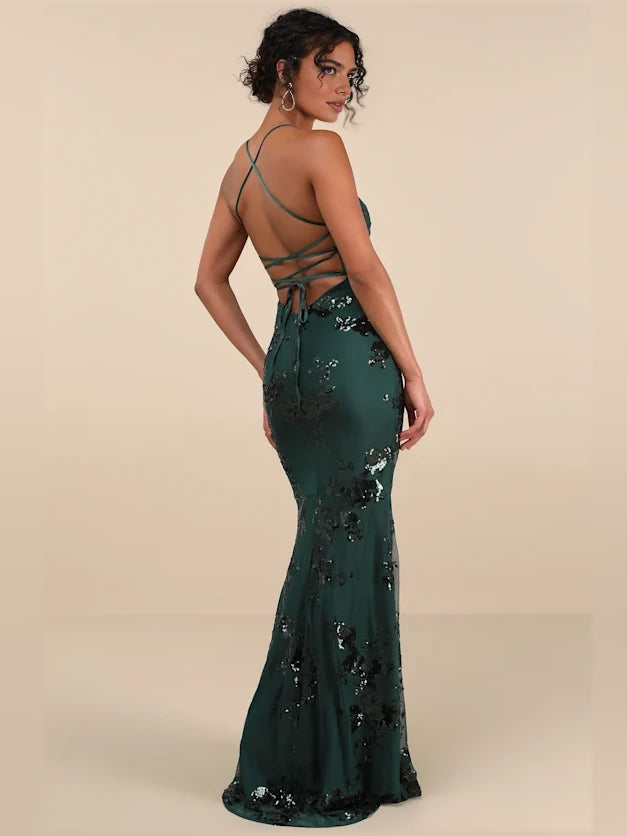 Emerald green sequin mermaid gown with V-neck and open-back strappy design