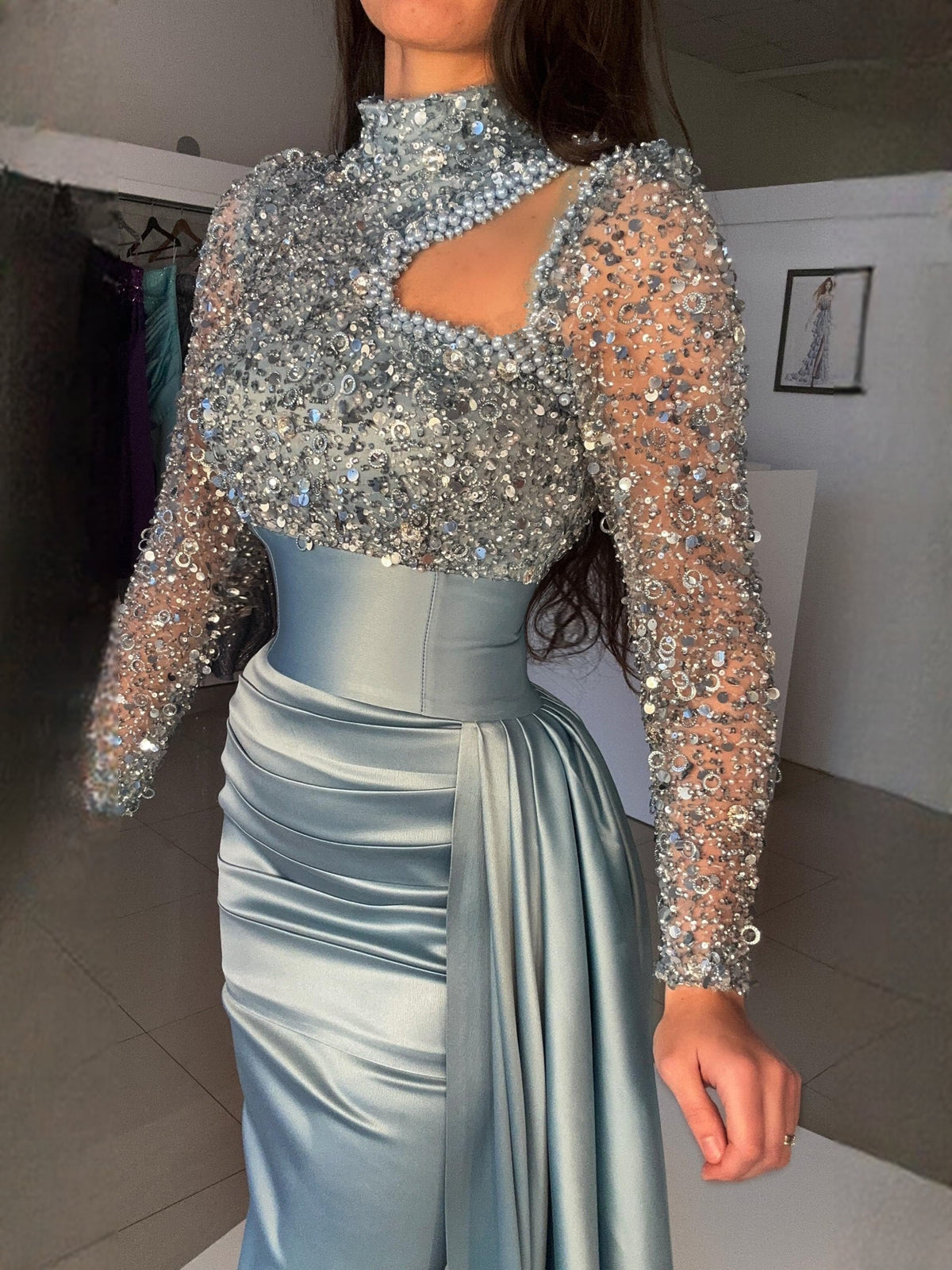 Dusty blue sequin bodice dress with long sleeves, cutout neckline, and mermaid skirt