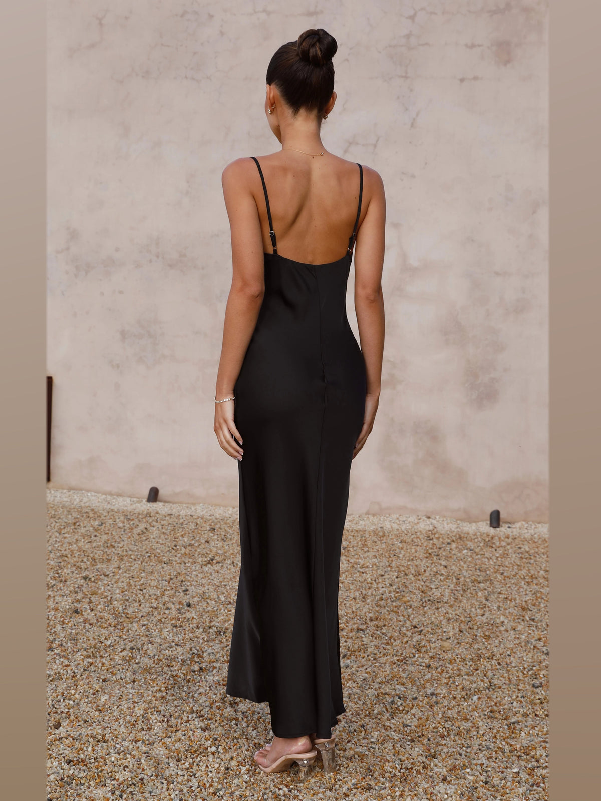 Black maxi formal dress, back full-length view showing the bodice