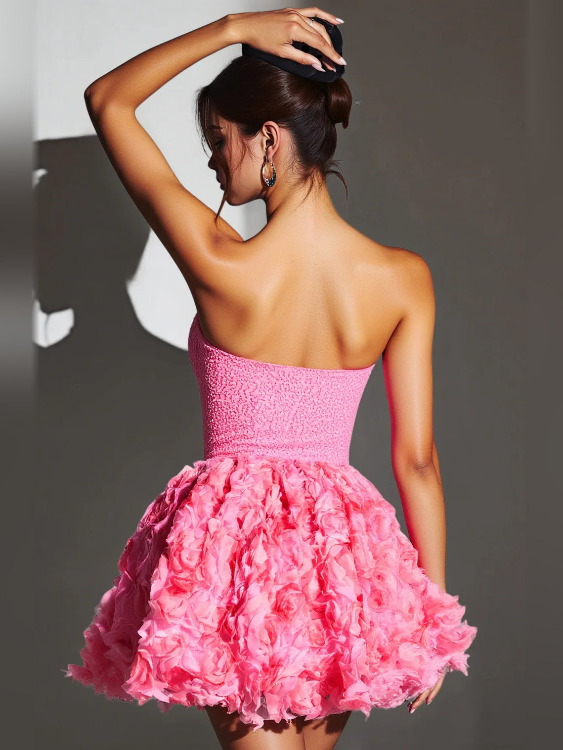 Pink strapless mini dress with corset bodice and full floral rosette A-line skirt back