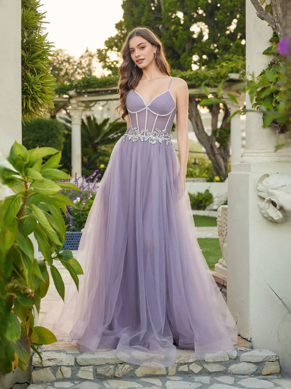 Lilac tulle prom dress with beaded floral corset, sweetheart bodice, and flowing skirt