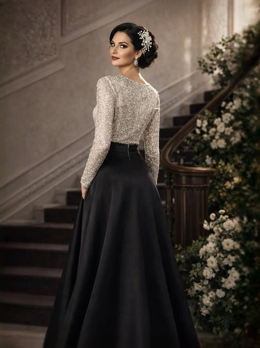 Silver sequin V-neck A-line floor-length dress with black satin skirt and waist bow