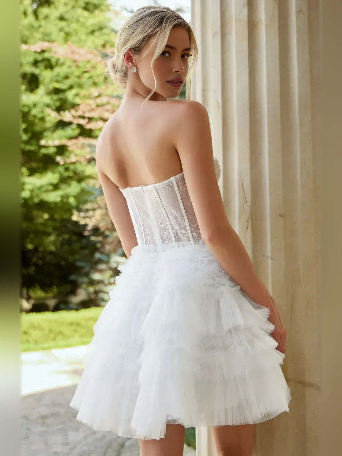 White strapless corset-style tiered A-line short tulle homecoming dress, back view