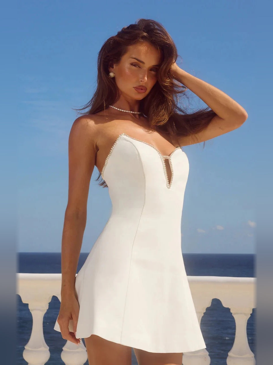 White strapless A-line mini dress with sweetheart neckline and short keyhole front