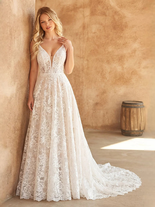 Ivory embroidered floral V-neck A-line tulle wedding dress, front view standing