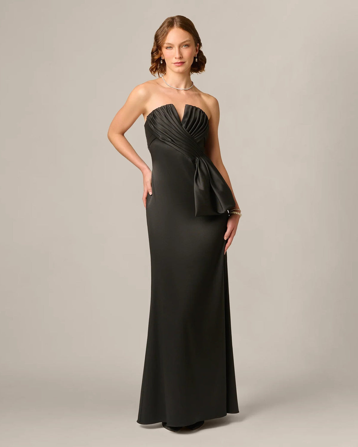 Black strapless A-line maxi dress with pleated bodice and gathered waist detail