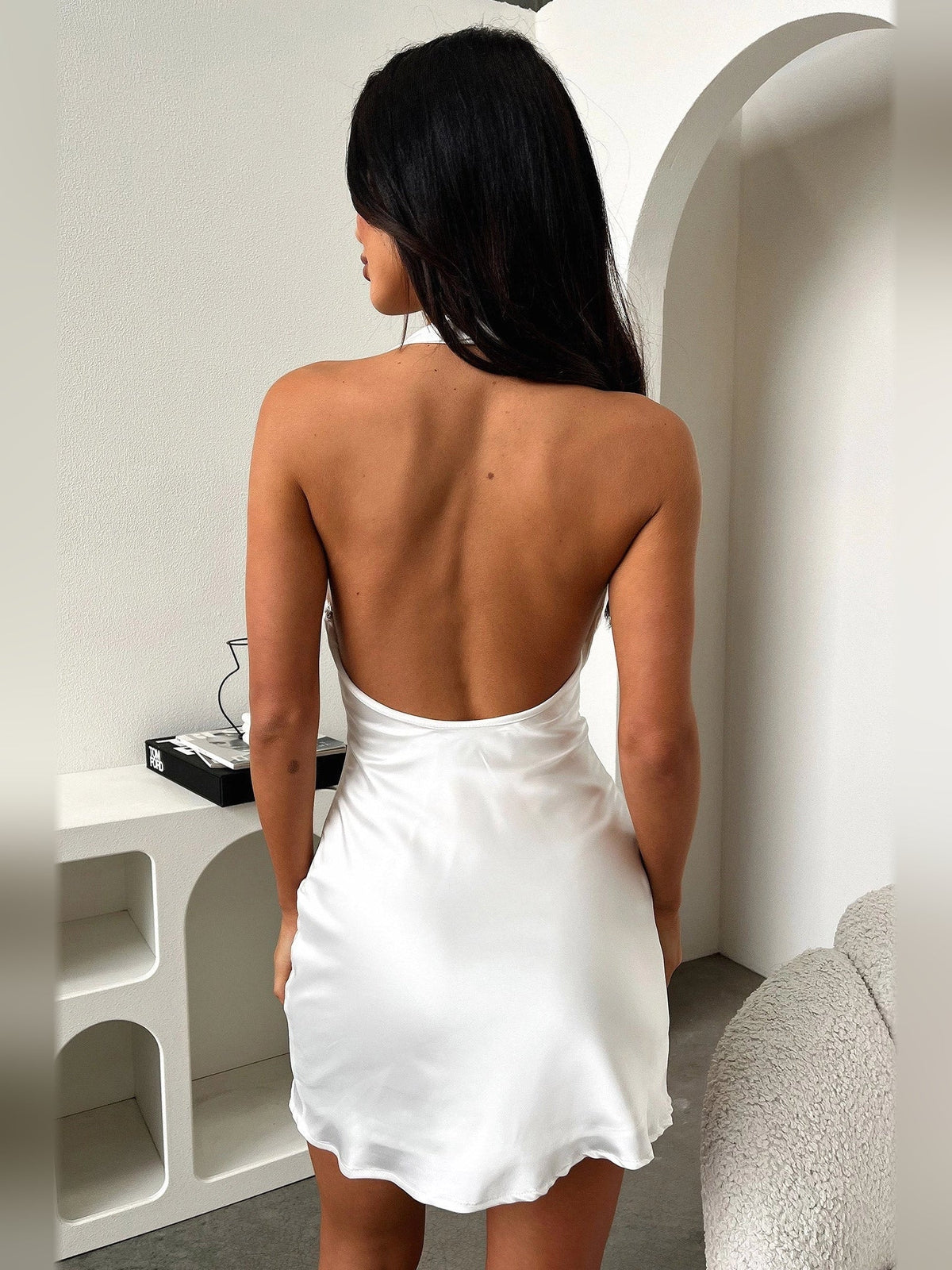 Ivory backless satin mini dress with draped cowl back and ruched lower back detail