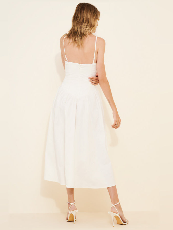 White midi formal dress with thin spaghetti straps and tiered skirt, back view