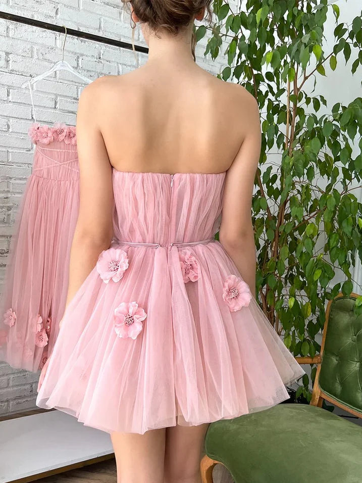Light pink strapless tulle mini dress, open back with floral appliques and layered skirt
