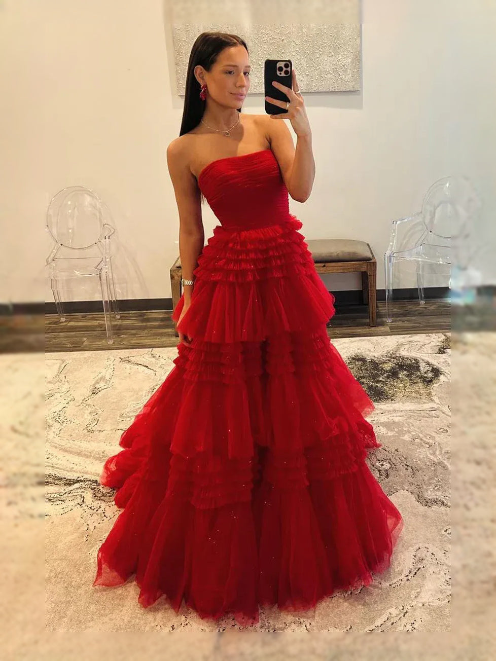 Red strapless tulle prom dress with tiered ruffle skirt and slit, side view