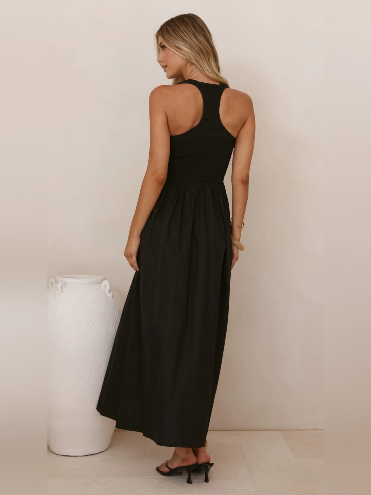 Black a-line maxi formal dress with a-line, full-length back view
