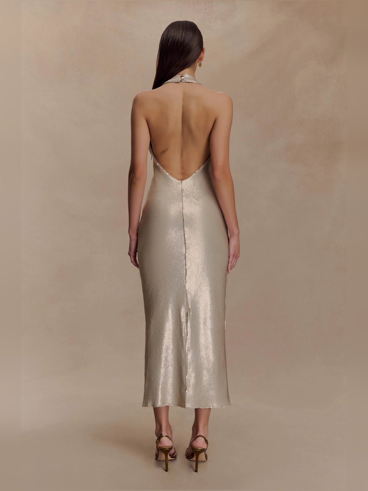 Gold sequin halter midi formal dress with open back and V-shaped back detail