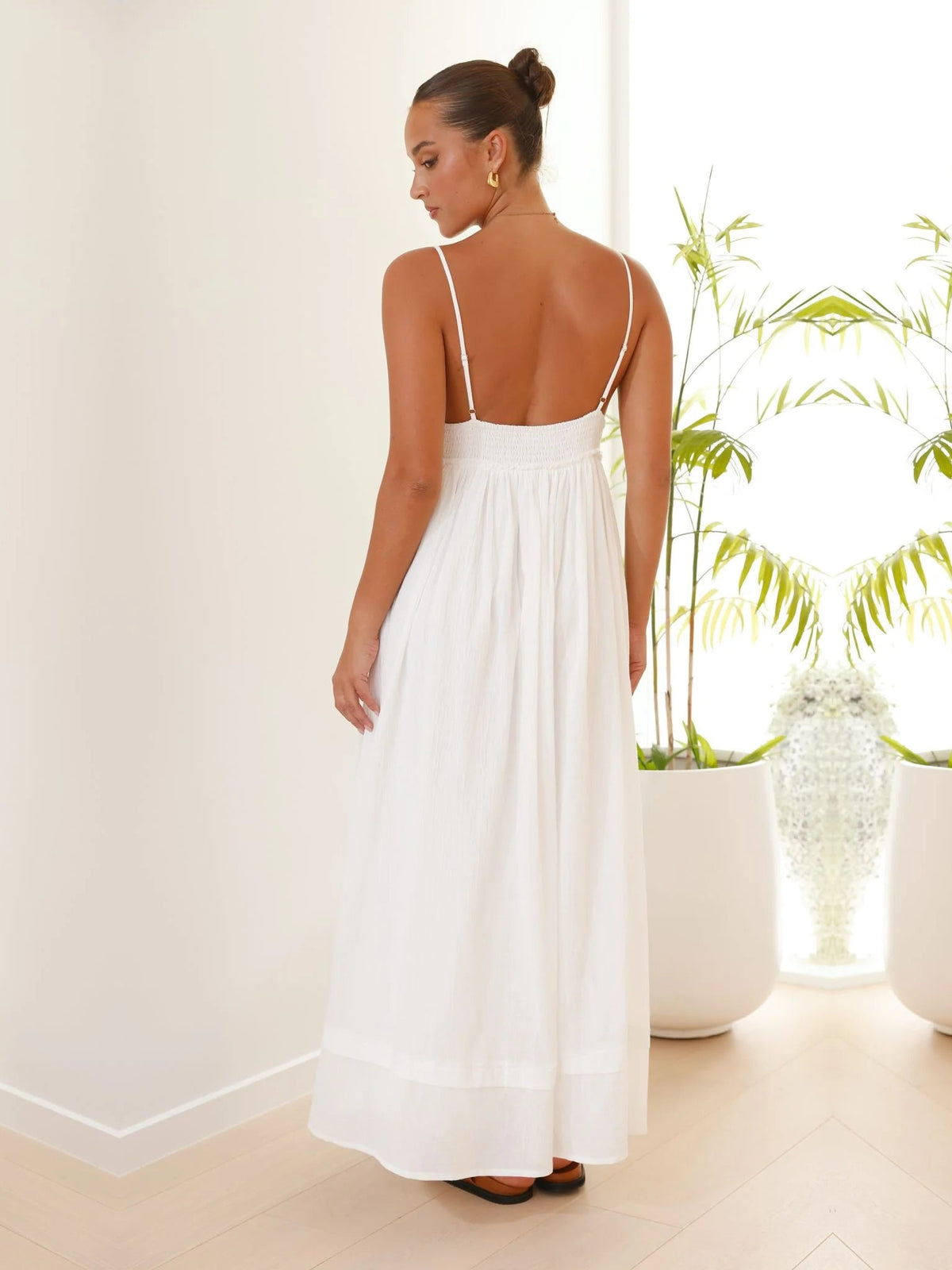 White a-line maxi formal dress with a-line, full-length back view