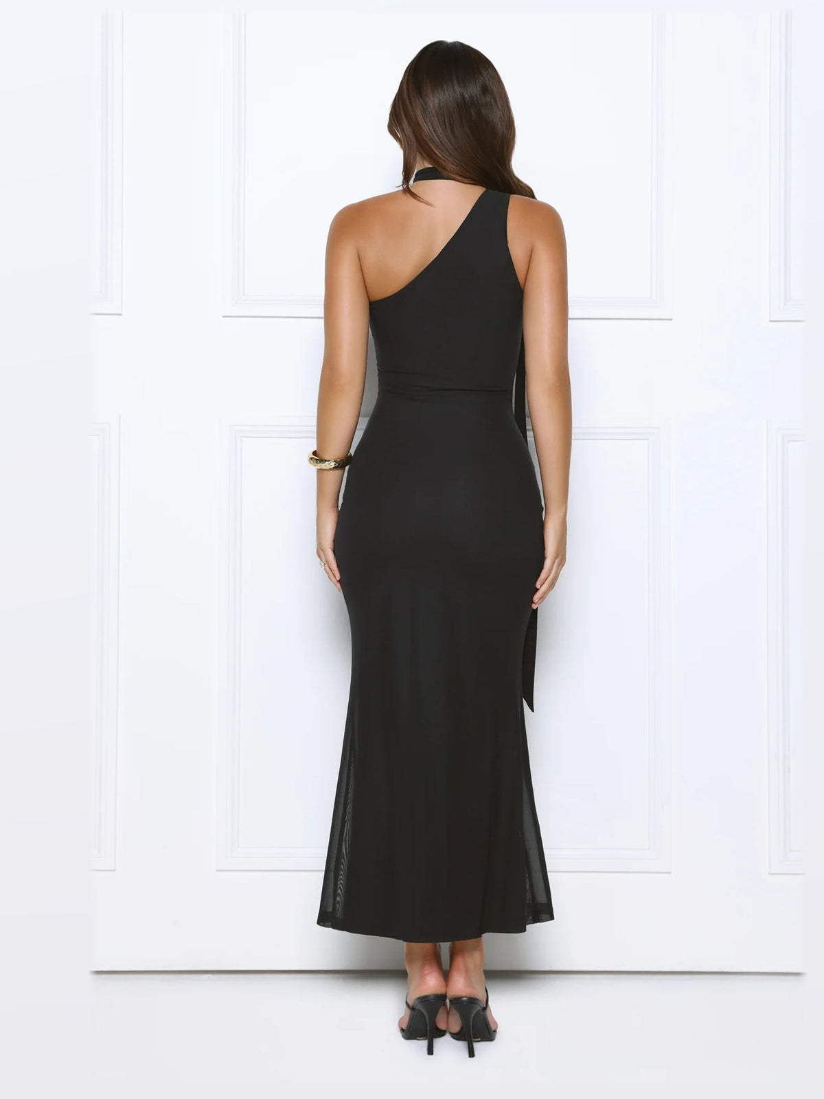 Black midi formal dress, back full-length view showing the bodice