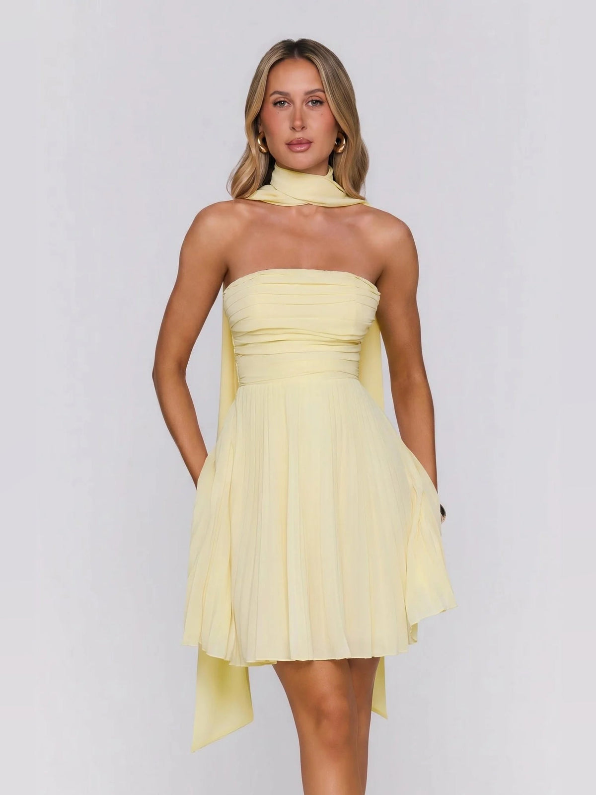 Lemon yellow strapless mini dress with draped overlay and asymmetrical hem points