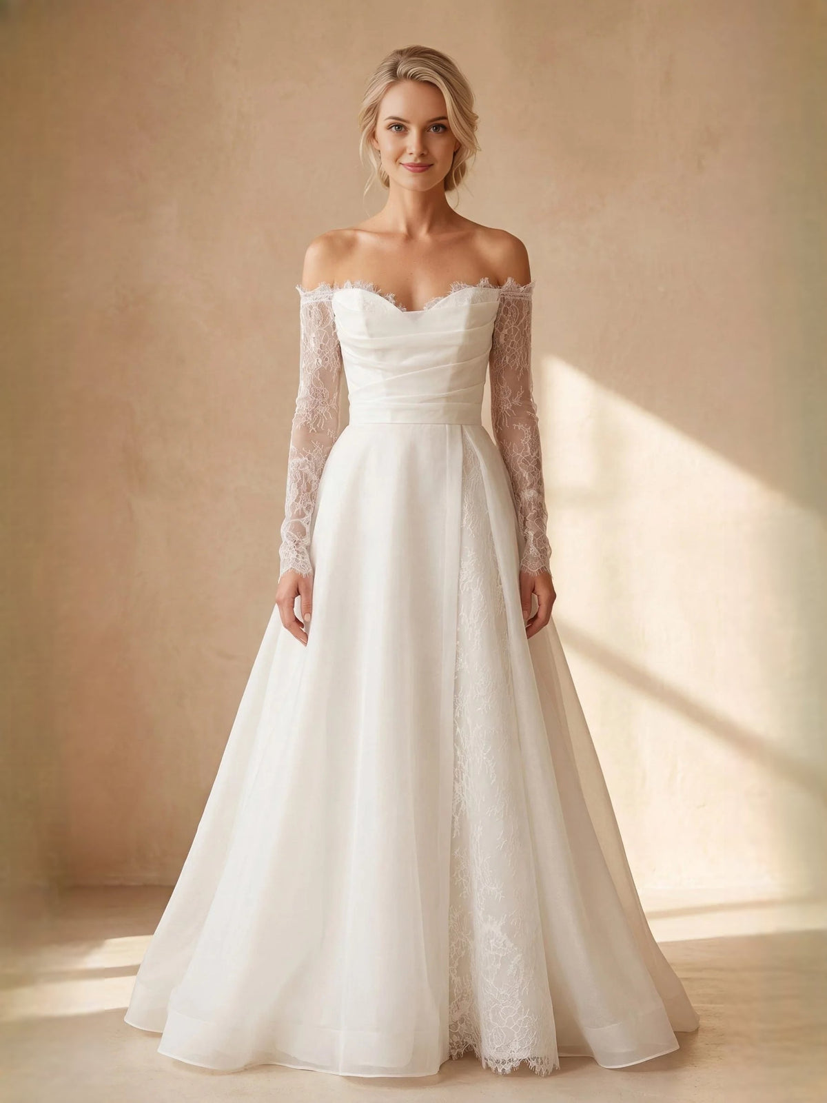Ivory sweetheart A-line wedding dress with lace long sleeves and flowing skirt