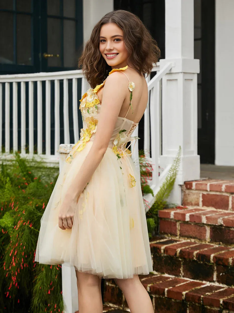 Pale lemon layered tulle mini dress with floral appliques and sleeveless square neckline