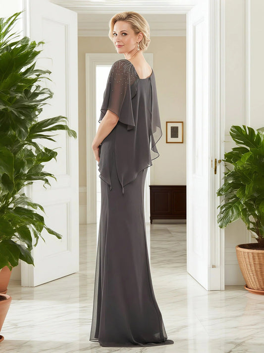 Grey sheath evening dress with beaded neckline and chiffon cape sleeves, side profile