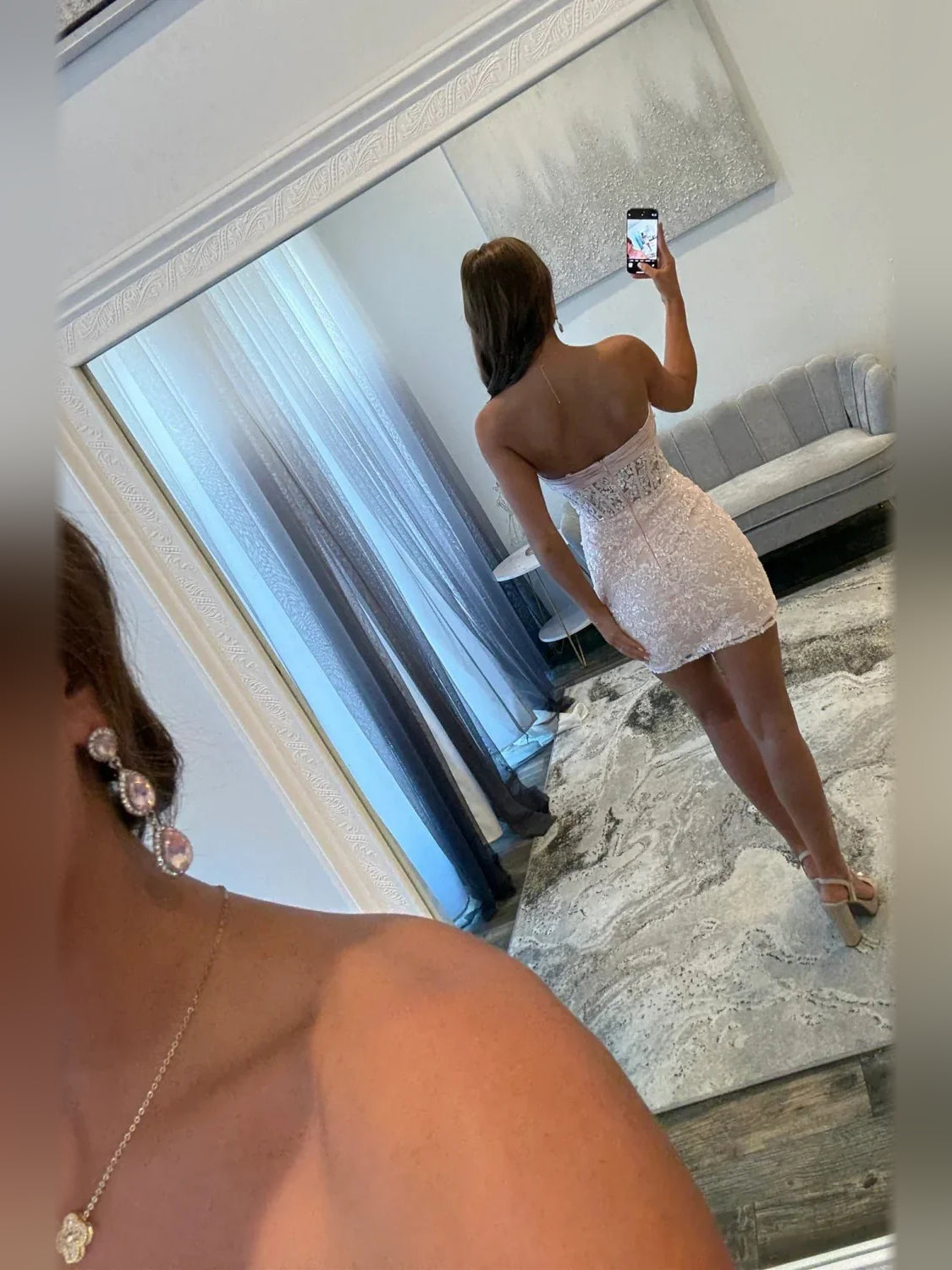 Blush strapless mini dress, back view with textured lace bodice and satin bow detail