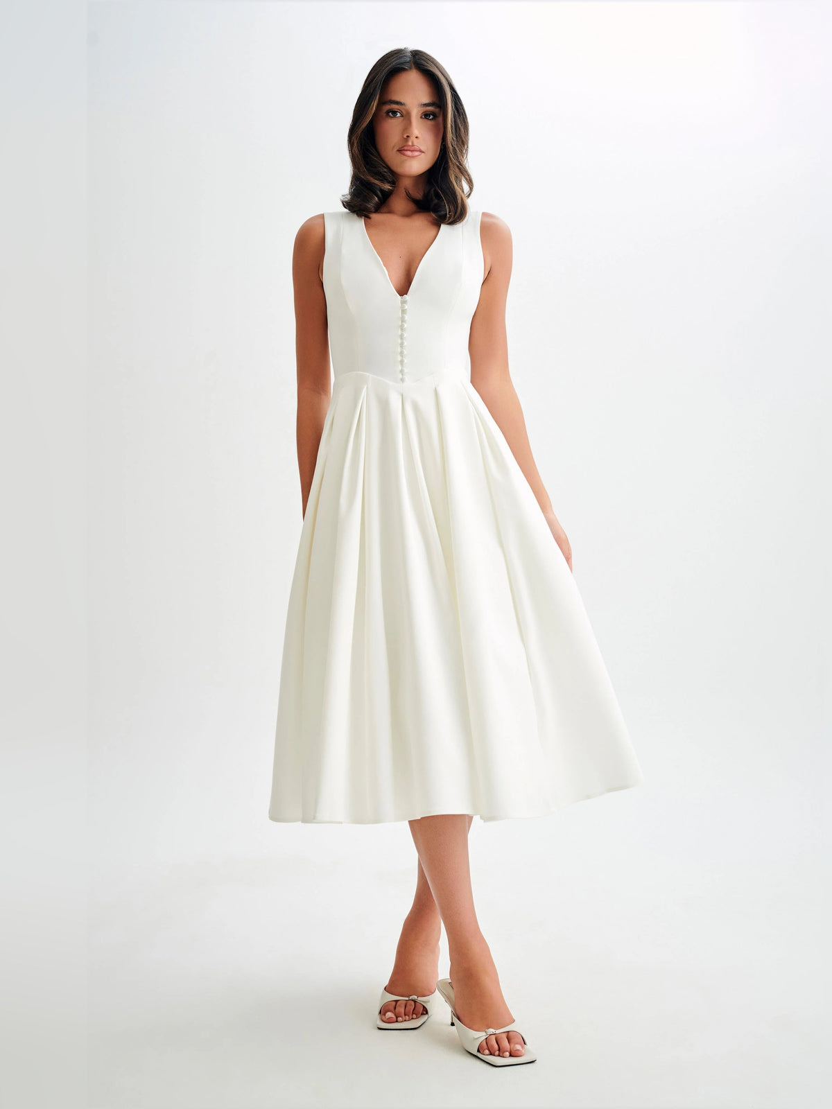 White sleeveless midi formal dress, deep V-neck bodice and flared pleated skirt