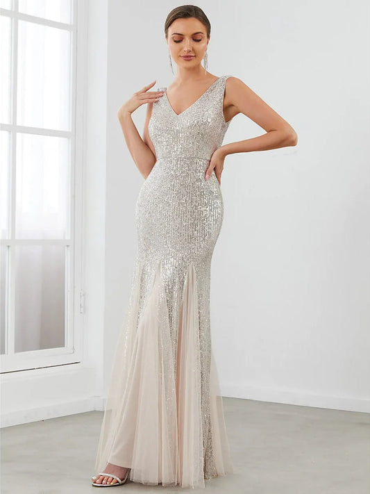 Silver V-neck sleeveless fitted dress with long sheer mermaid-style hem