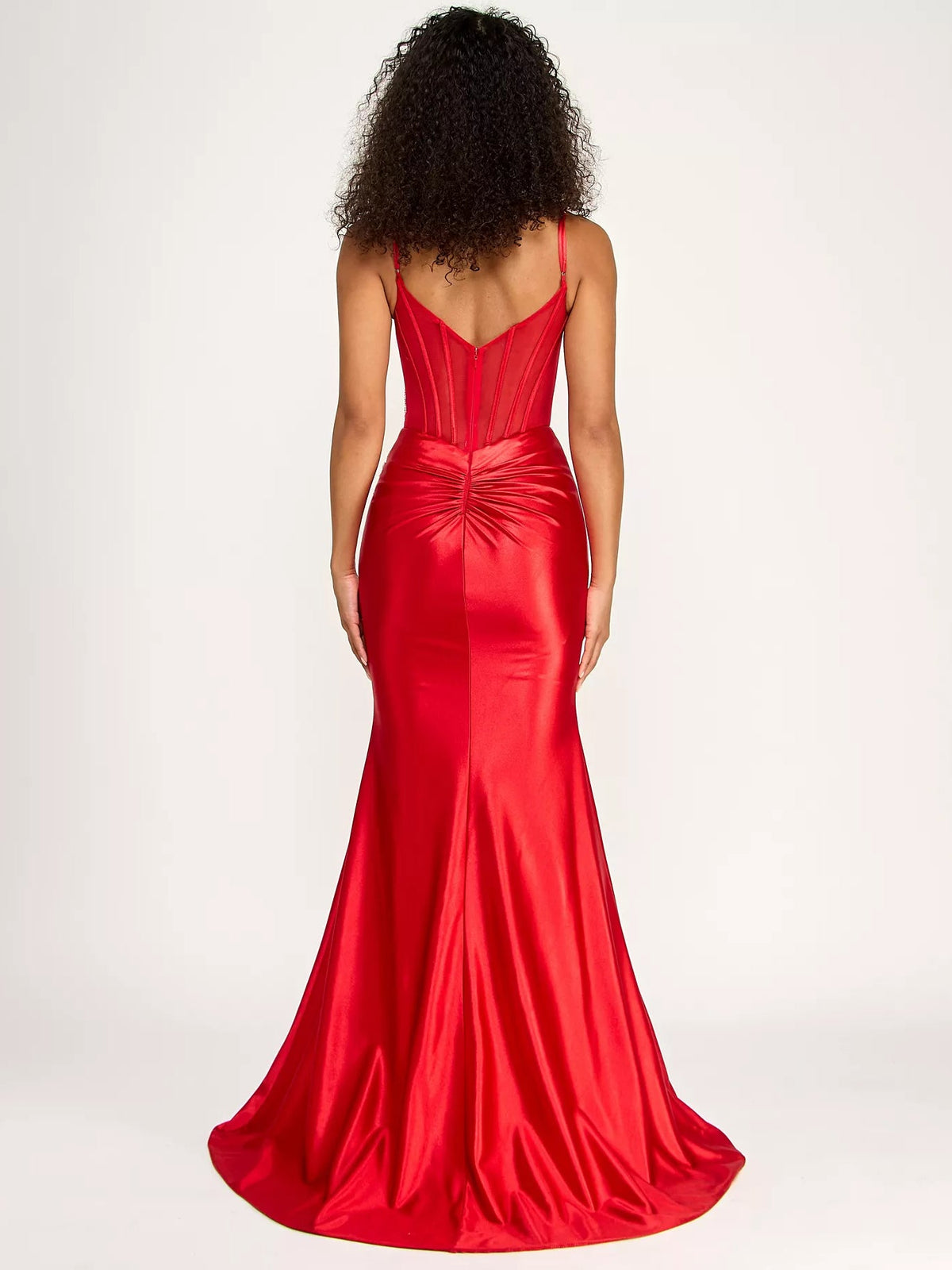 Red V-back corset formal dress with ruched detailing and floor-length trumpet skirt