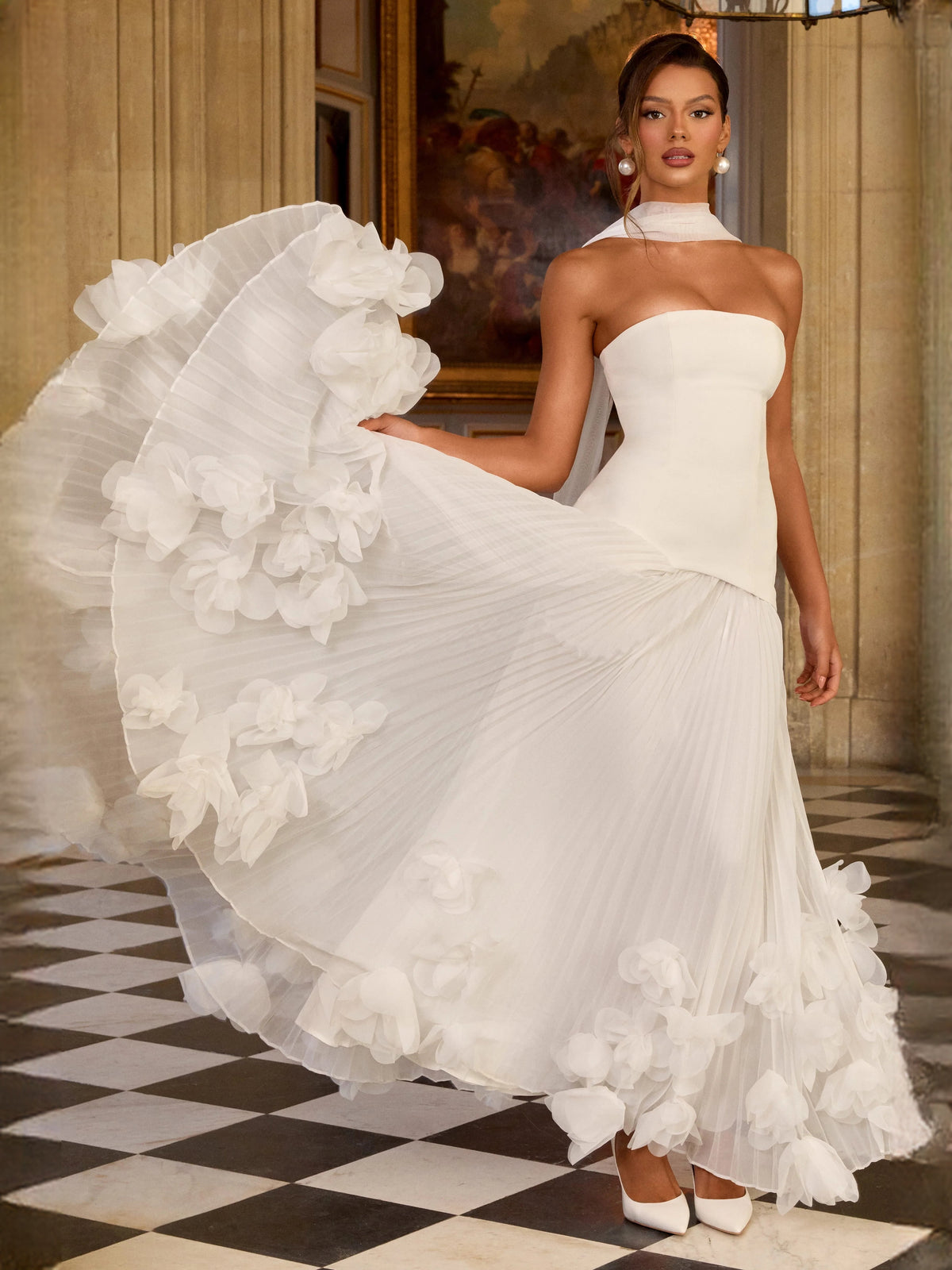 Ivory strapless sheath wedding dress with corset bodice and sweeping layered floral ruffles