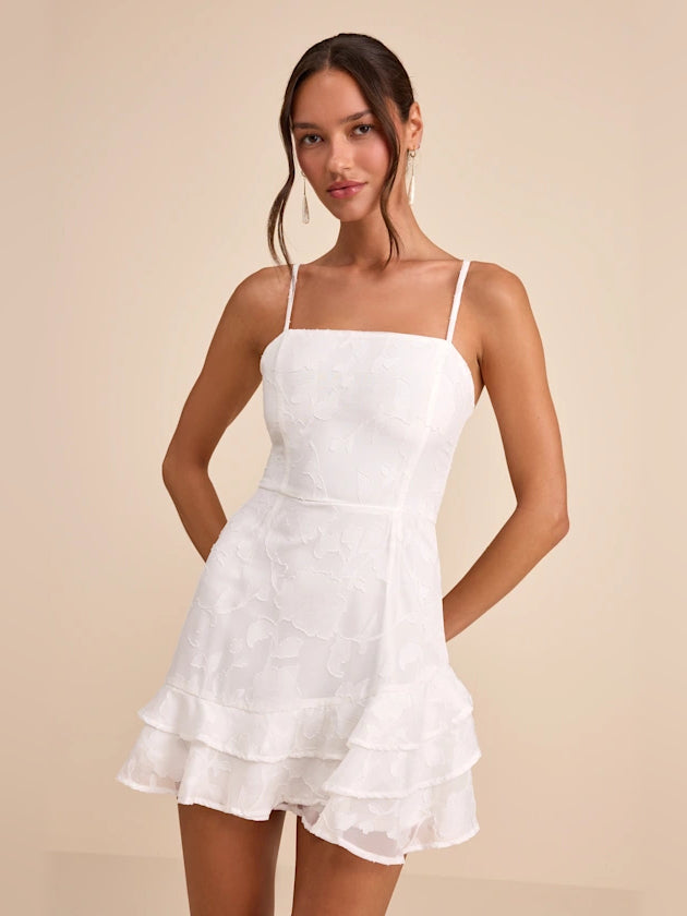 White mini homecoming dress with spaghetti straps and layered ruffle skirt
