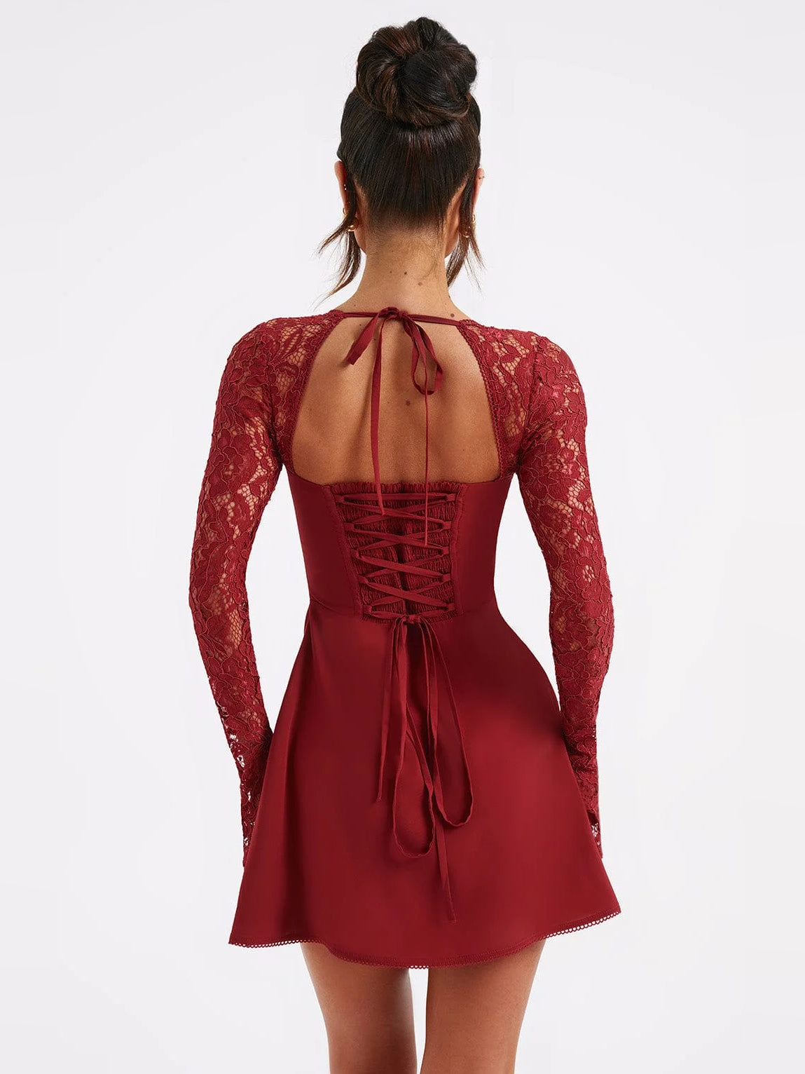 Red mini dress with open lace back and crisscross corset-style lacing, long lace sleeves