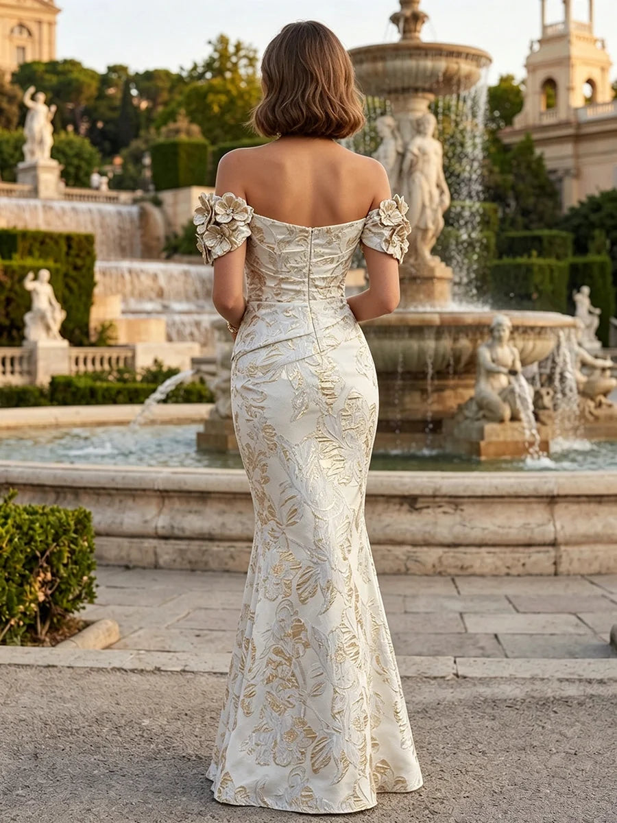 Back view off-shoulder mermaid evening dress in champagne with floral applique and ruched bodice
