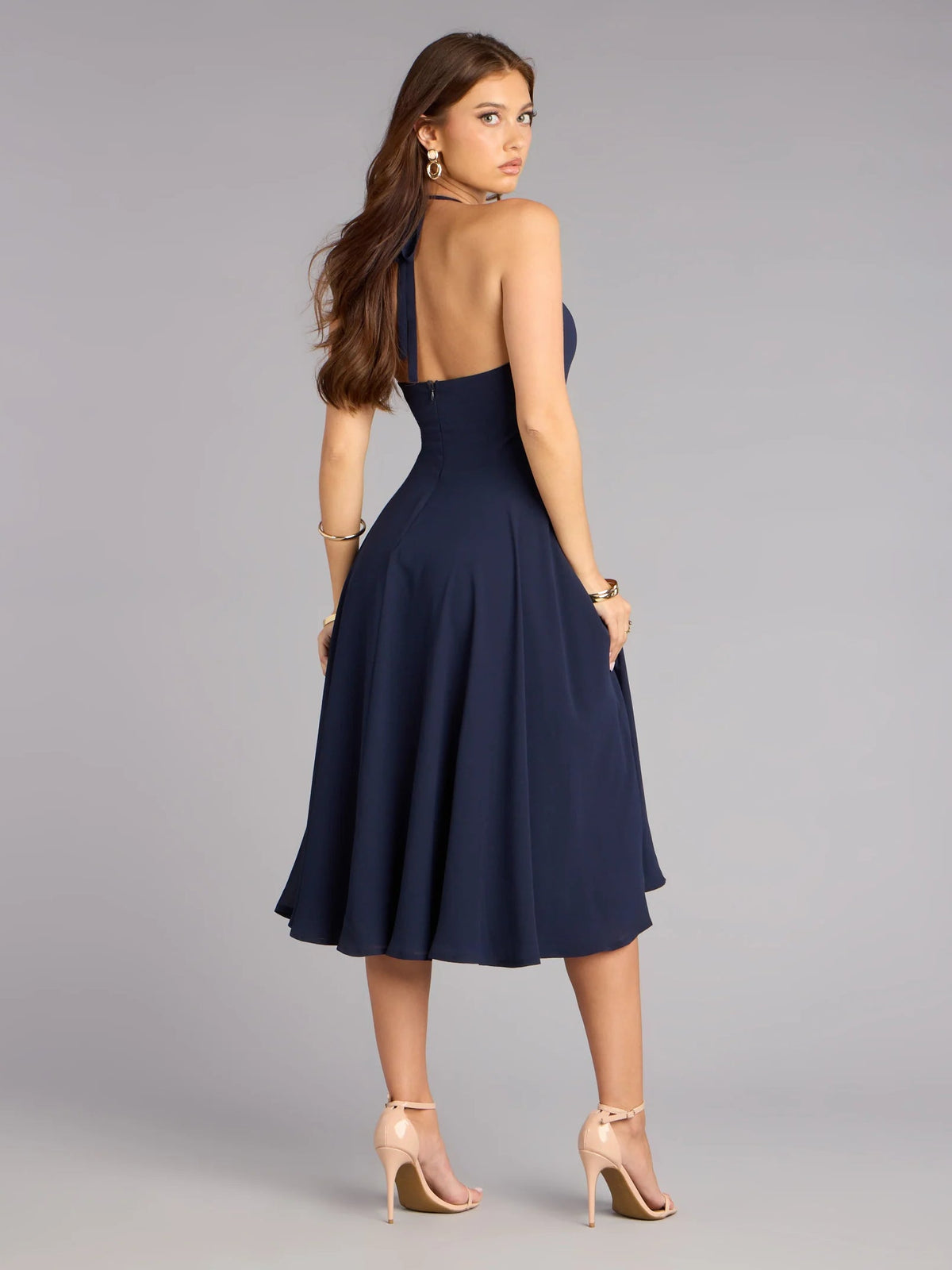 Blue chiffon midi formal dress with open-back halter design and flared skirt