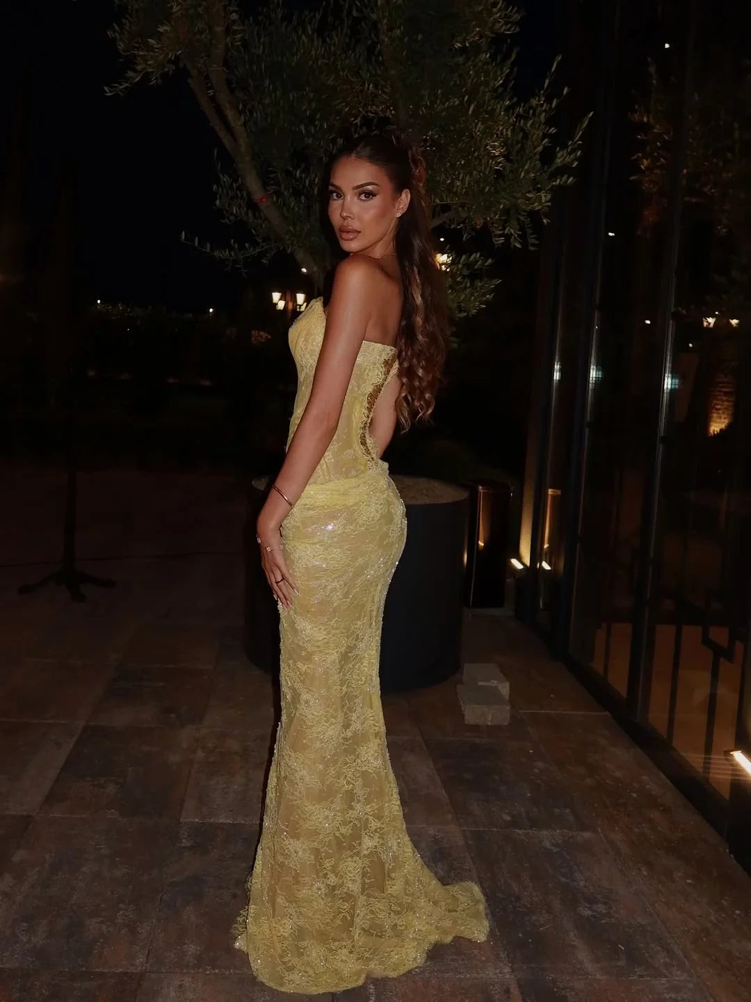Yellow sweetheart ruched prom dress with draped bodice and floor-length side slit