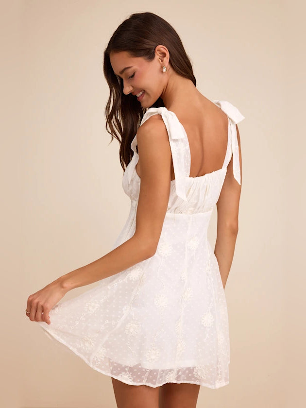 White embroidered open-back mini dress with square front and flared skirt